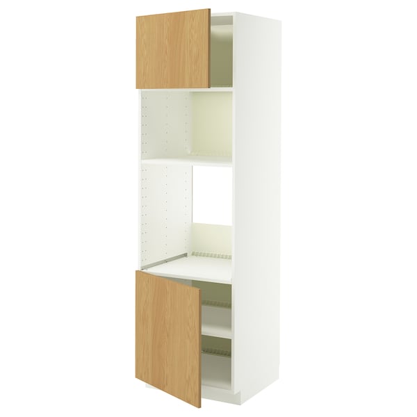 A white IKEA METOD kitchen cabinet with adjustable wooden shelves and natural oak doors, one open.