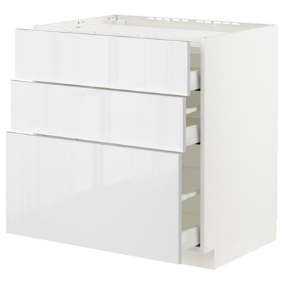 White modern kitchen cabinet with three drawers and high gloss finish.