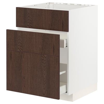 A white kitchen cabinet with dark brown wooden drawers. It has a modern design and is part of the METOD kitchen system.