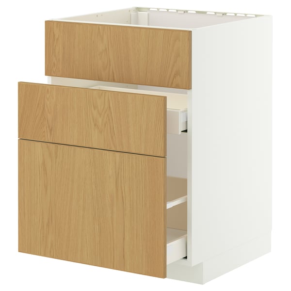 A white IKEA METOD kitchen cabinet with light oak drawers. Modern design, smooth-running drawers, sturdy construction.
