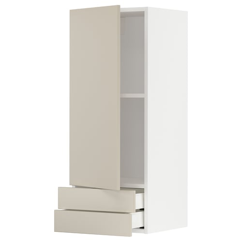 An ikea METOD kitchen cabinet in beige with a smooth design. It includes two drawers and a tall storage space.
