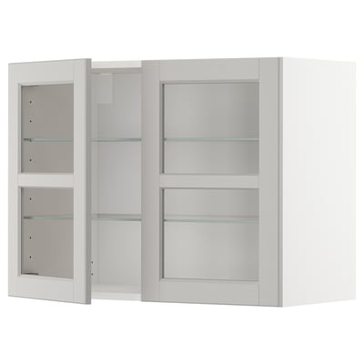 White METOD wall cabinet with glass doors. Sleek, modern design with three adjustable shelves and bevelled glass edges.