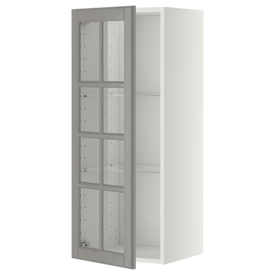White METOD kitchen cabinet; grey glass doors with bevelled edges, adjustable shelves, nickel hinges.