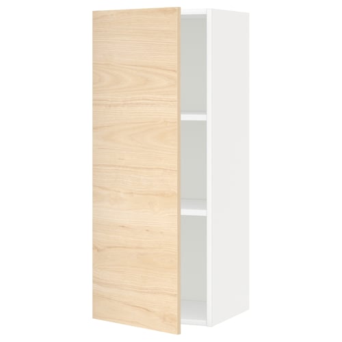 An open METOD kitchen cabinet with light ash wood-patterned door and white interior.