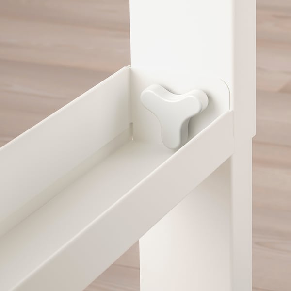 White desk with adjustable height mechanism on wooden floor.