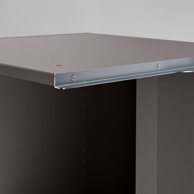 Modern storage unit with sleek, silver edging and dark finish, designed for efficient use of corner space.