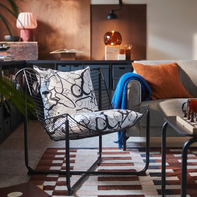 SKÅLBODA black wire chair, modern & sleek with curved design.