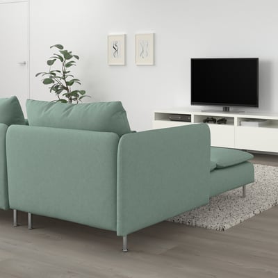 Modern light green sofa sectional with tv stand; minimalist living room setup.
