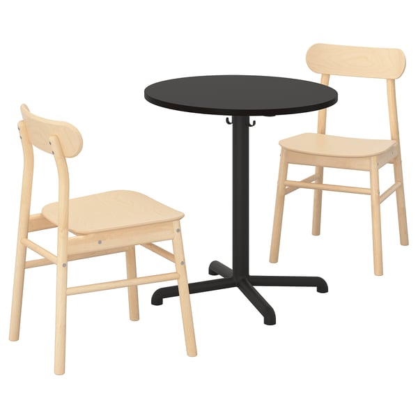 A STENSELE furniture set including a black round table and two light wooden chairs with curved backrests and seats.