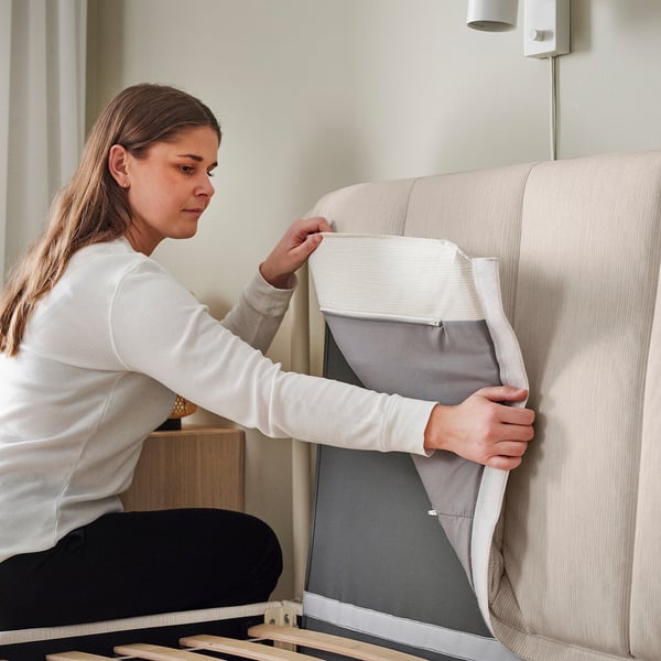 TÄLLÅSEN Upholstered bed frame with mattress, Kulsta light beige/Valevåg extra firm, Queen