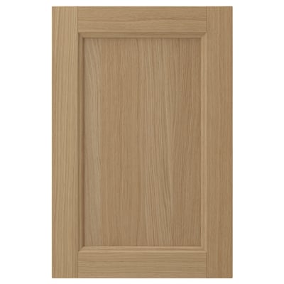 VEDHAMN natural oak cabinet door. Rectangular shape, solid wood frame, veneer panel. Warm, rustic design.