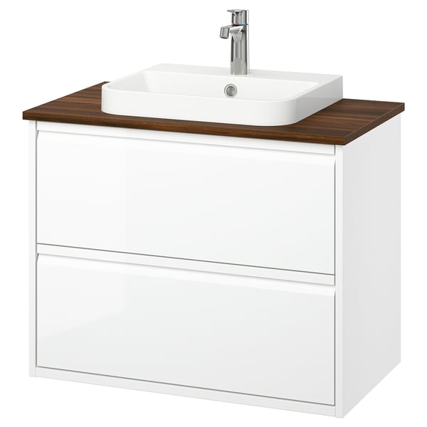 A sleek white ÄNGSJÖN bathroom vanity with a wooden countertop and a square modern sink.