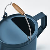 Blue watering can with wooden handle and metal clip, showing quality design and durability.