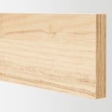 Close-up of light ash wood finish drawer front, smooth and well-crafted, highlights natural wood texture and quality.