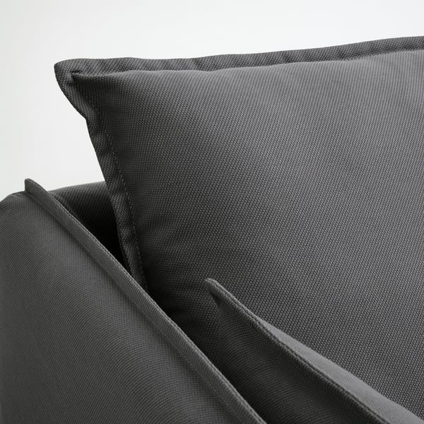 Close-up of a soft, grey upholstered sofa cushion with a neat, smooth edge, showcasing high-quality fabric.