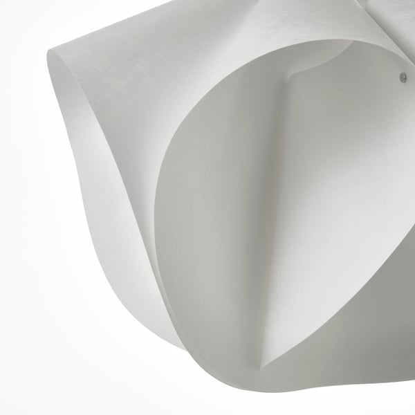 White pendant lamp with soft, textured shade.