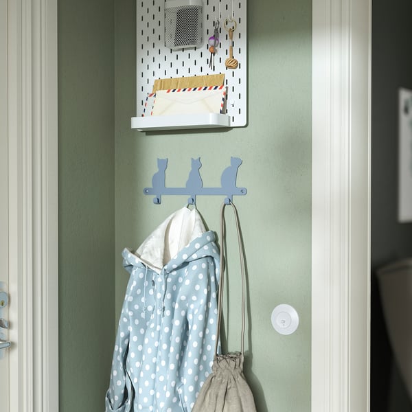 Cat-shaped kids hooks hold jacket & bag.