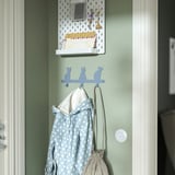 Cat-shaped kids hooks hold jacket & bag.