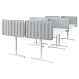 Six modern desks with acoustic screens, vertical grooves, white legs.