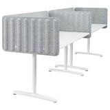 Three modern, white workstations with gray sound-absorbing panels, sleek legs, and adjustable heights. Ideal for office settings.