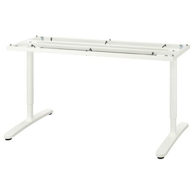 A white BEKANT desk with adjustable legs and a sleek design.