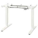 A BEKANT white adjustable desk frame. The frame is made of steel and aluminium, featuring a sleek, modern design with adjustable height settings.