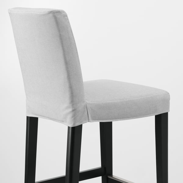 Modern bar stool. Light gray upholstered cushion on black metal base. Comfortable and stylish.