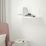 Minimalist shelf & table setup with decor.