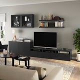 Modern living room with BESTÅ tv unit, flat screen, sofa, and coffee table.