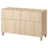 Light wood BESTÅ sideboard with four doors and two drawers.