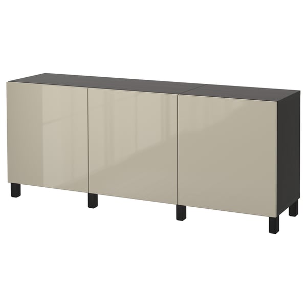 Depicts an off-white BESTÅ sideboard with four doors and black legs. Minimalist design provides ample storage.