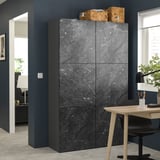 Modern dark grey BESTÅ storage unit with marble effect. Rectangular, four doors, surrounded by office decor.