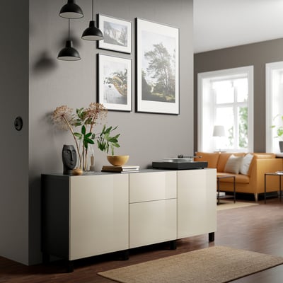 Modern living room with BESTÅ sideboard, pendant lamps, and decor items.