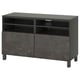 Modern black tv stand, BESTÅ series, with shelves and cabinet doors for storage, featuring clean lines and minimalist design.