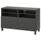 Dark gray BESTÅ tv stand with adjustable shelves and soft-closing drawers.