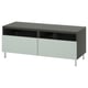 Modern black and light gray BESTÅ tv stand with two drawers and open shelves, sleek metal legs.