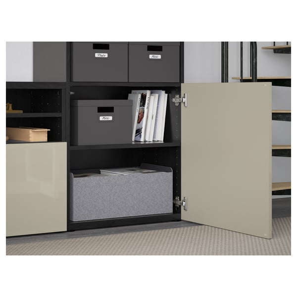 BESTÅ tv unit with grey boxes and magazines, open door shows shelf and drawer.