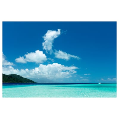 BILD poster. Blue ocean, sky, clouds, hill. Colourful, rectangular.