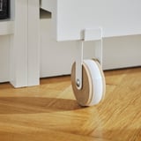 White BILLY bookcase with wooden floor, featuring a circular drawer with castors.