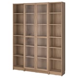 BILLY bookcase with glass doors in oak. Six compartments, adjustable shelves. Compact, modern design for homes.