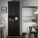 Modern living space with BILLY black bookcase, framed photo, toys, and white kitchen with wooden chairs.