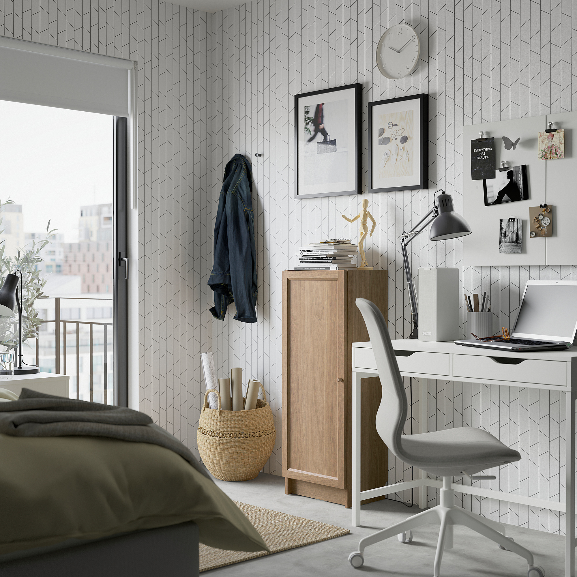 Modern living room with white BILLY bookcase. Stylish, versatile storage next to white desk and gray chair.