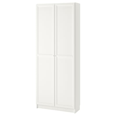 A white BILLY bookcase. It has a rectangular shape with two closed panel doors. Made of particleboard and fibreboard, it adjustable shelves.