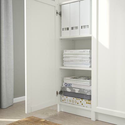 White BILLY bookcase with adjustable shelves and storage boxes.