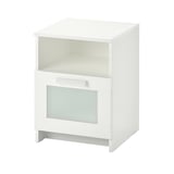 A white ikea BRIMNES bedside table with a shelf and drawer. The drawer has a glass front, and the piece is simple and modern in design.