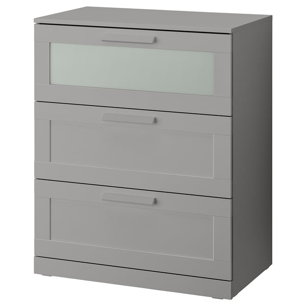 Gray BRIMNES chest with 3 drawers and frosted glass top for safety and style.