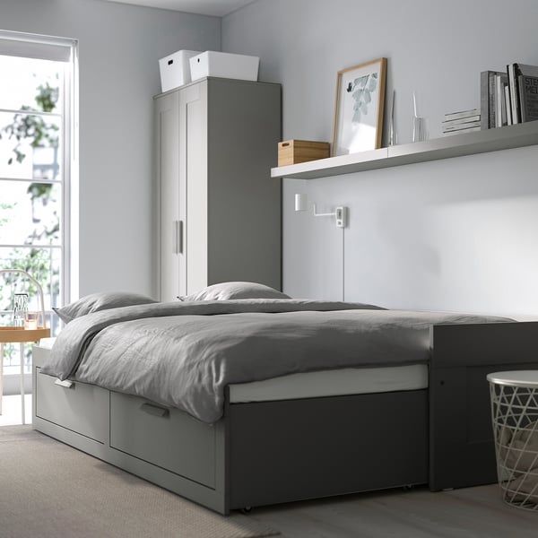 Minimalist bedroom with BRIMNES day-bed, storage, and tall wardrobe.