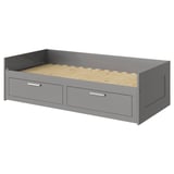A gray ikea BRIMNES day-bed in modern design with two drawers for storage.