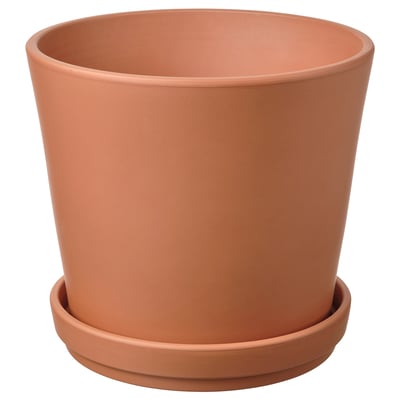 Orange terracotta planter with saucer.
