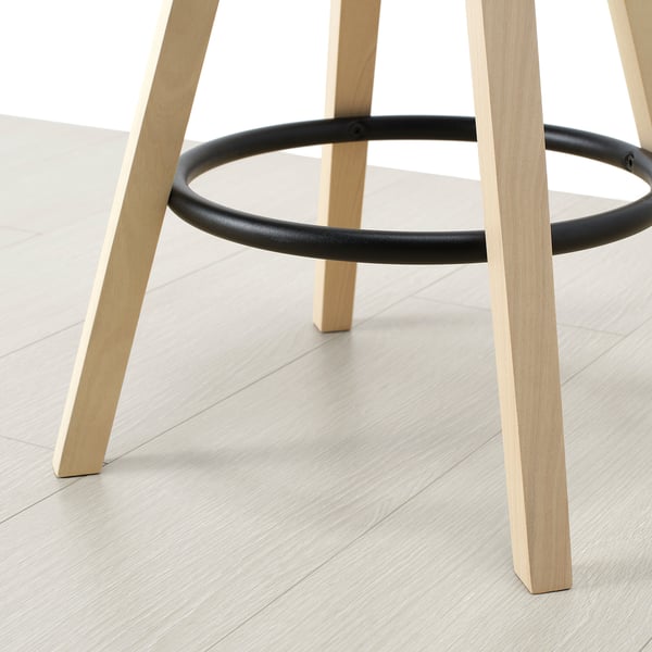 Modern light wood bar stool with sturdy black metal footrest, designed for comfort and durability.
